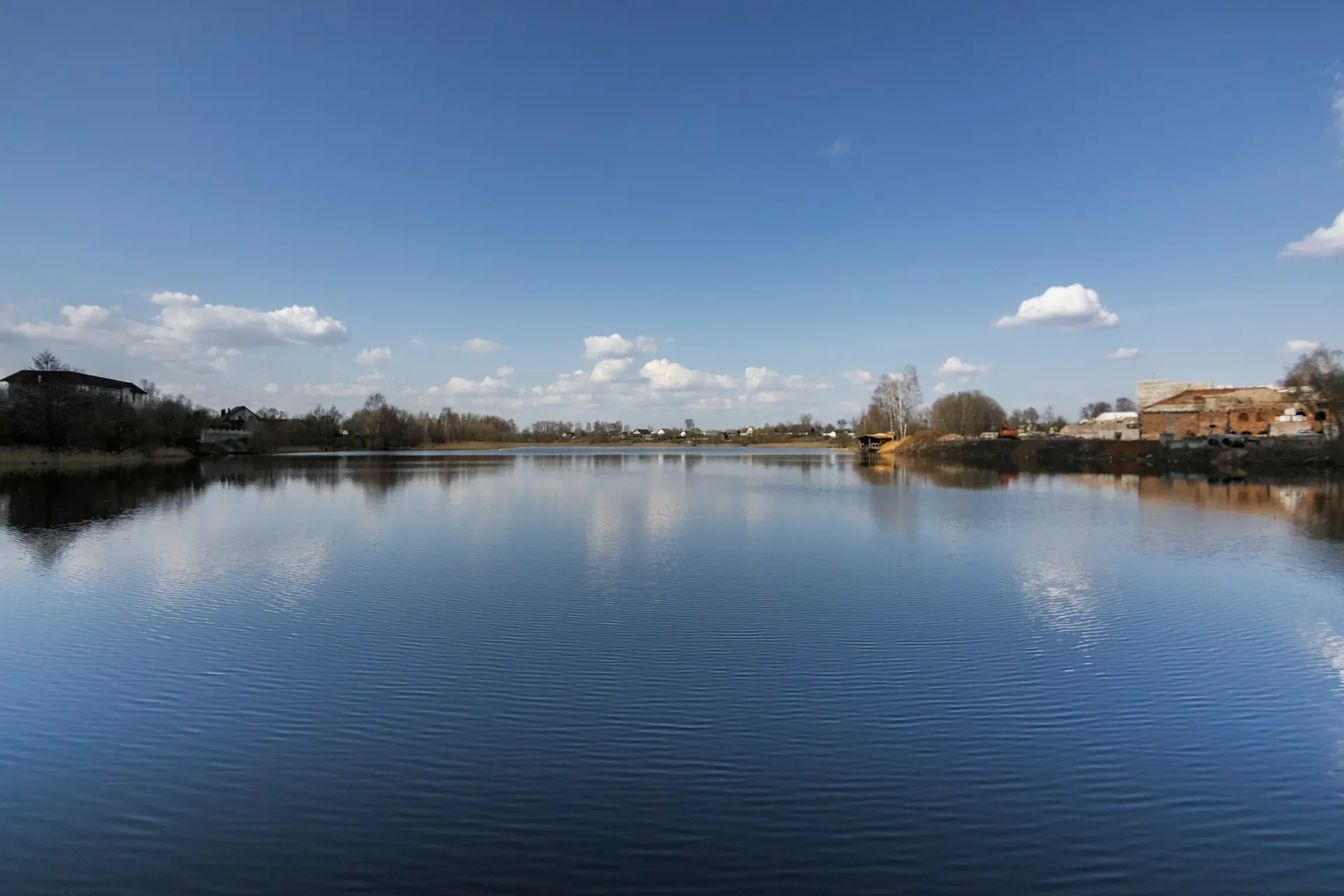 a large body of water surrounded by trees