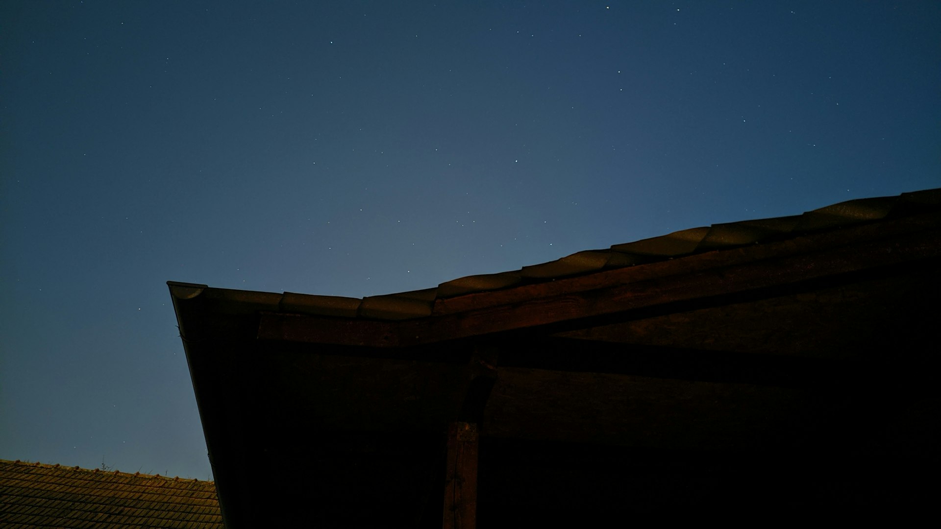 brown wooden fence under blue sky during night time