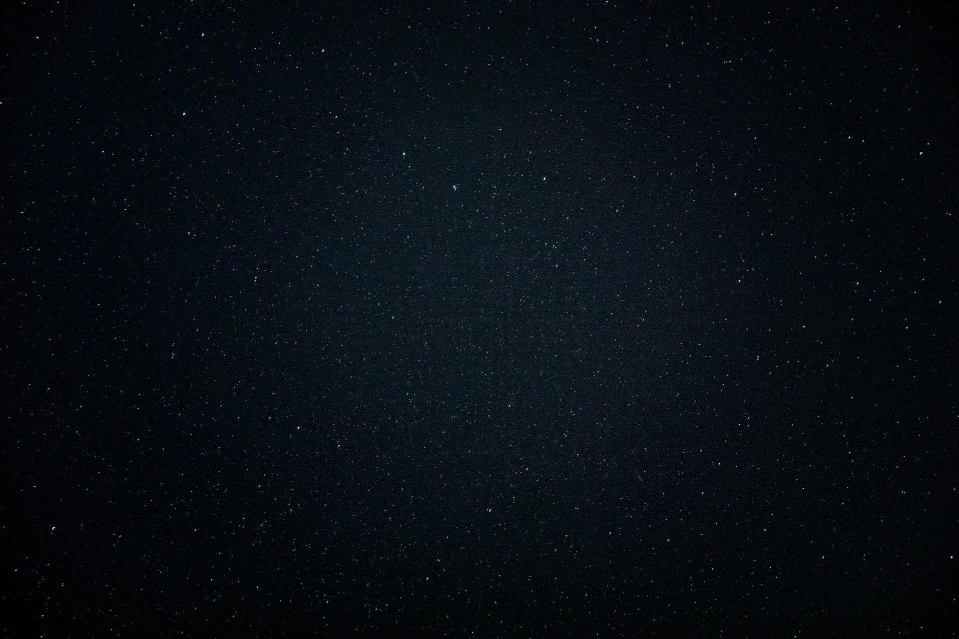 a night sky with a few stars in it