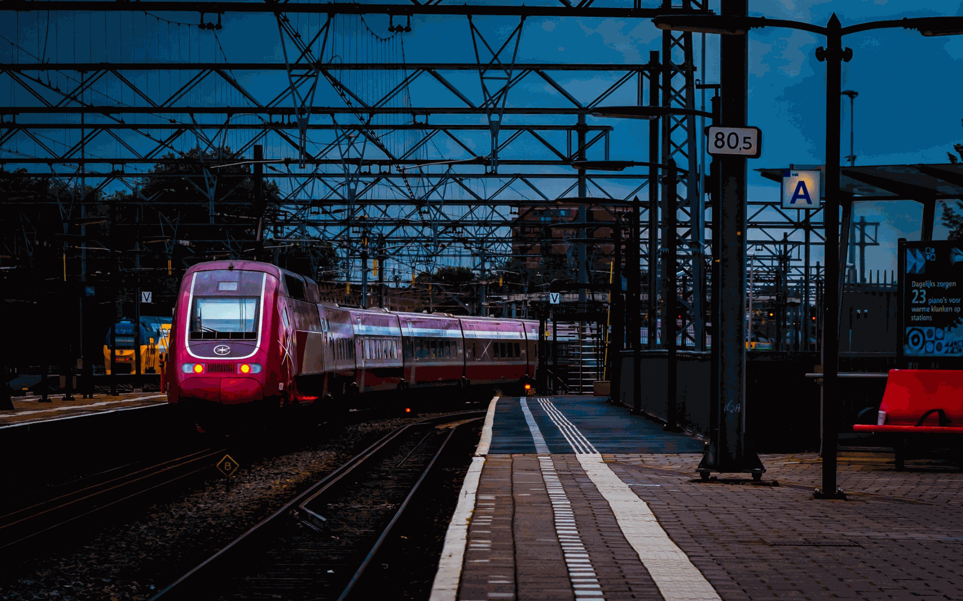 https://unsplash.com/photos/a-red-train-traveling-down-train-tracks-next-to-a-train-station-FFPYSvIEsO4?utm_content=creditShareLink&utm_medium=referral&utm_source=unsplash