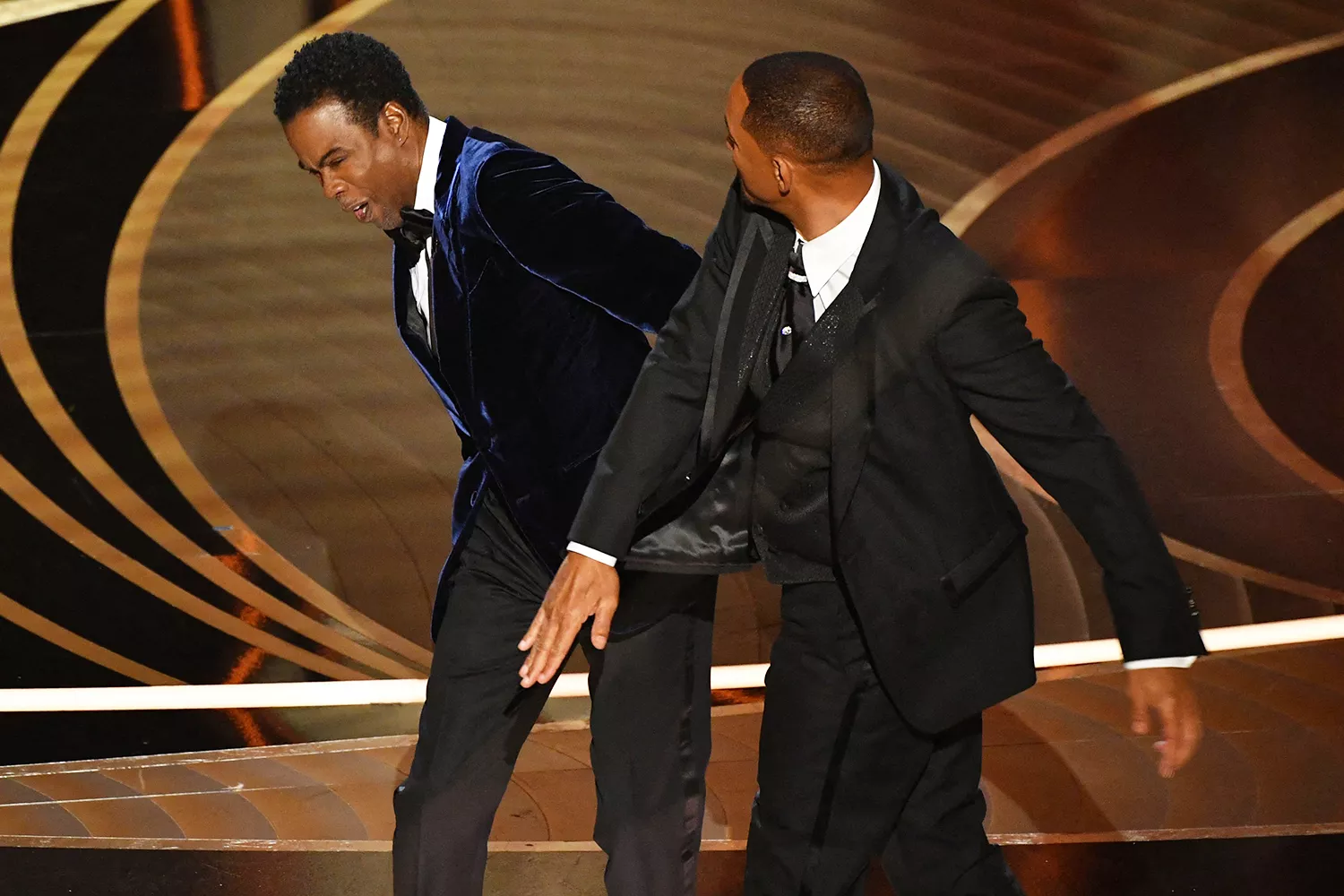 Will Smith slaps Chris Rock onstage during the 94th Oscars in Hollywood, California on March 27, 2022. ROBYN BECK/AFP via Getty