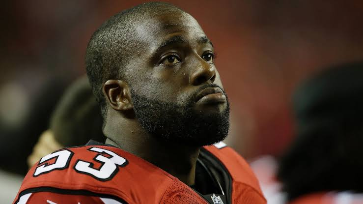 Football helmet on a stadium field, representing Brian Banks' return to football after exoneration Football helmet on a stadium field, representing Brian Banks' return to football after exoneration